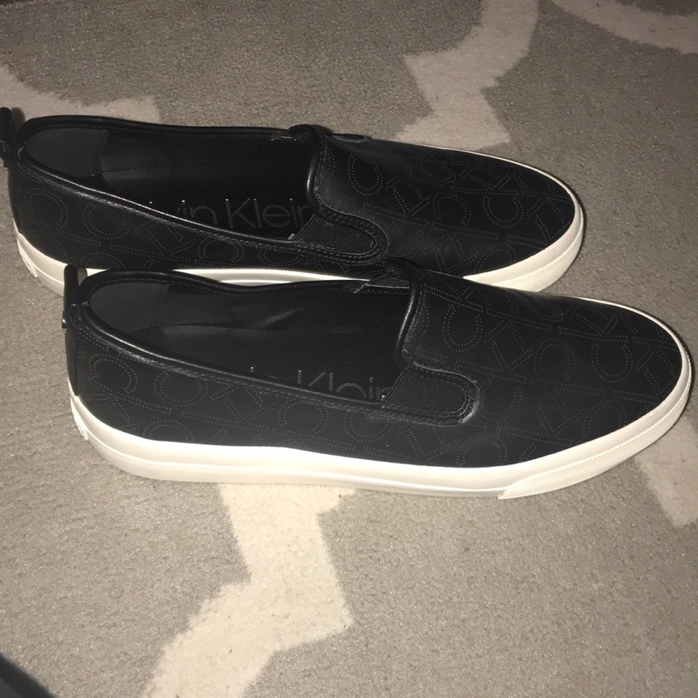 Black Calvin Klein slip on sneakers